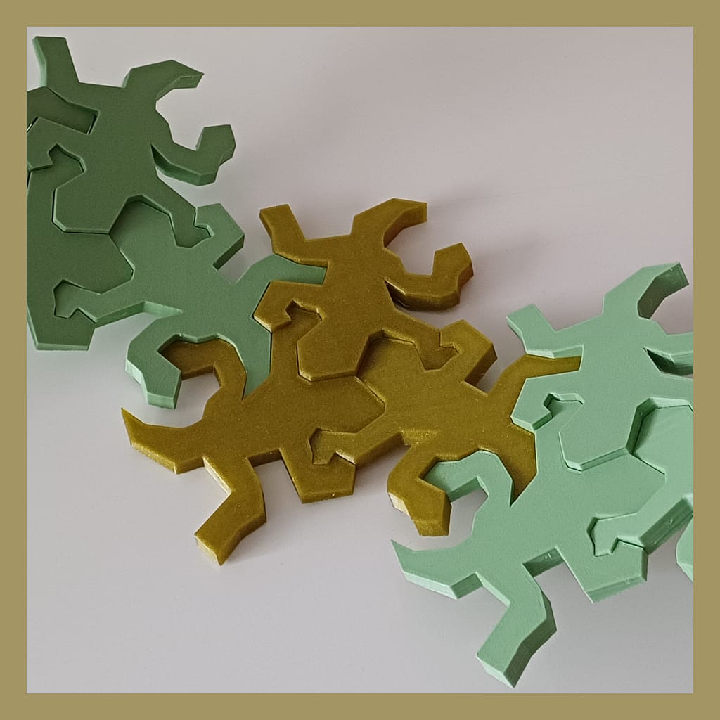 Connected Escher inspired lizards snapped together showing the intended inwards curve details used for decoration.